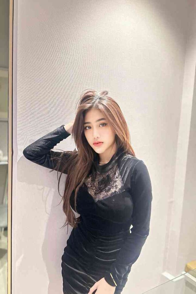 Young woman in black velvet dress